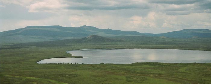 Diniizhoo (centre, across lake) looking west from Van Tat, July 2004.
